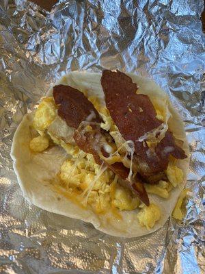 Breakfast Taco - eggs, potatoes, bacon, cheddar cheese. Lacked flavor.