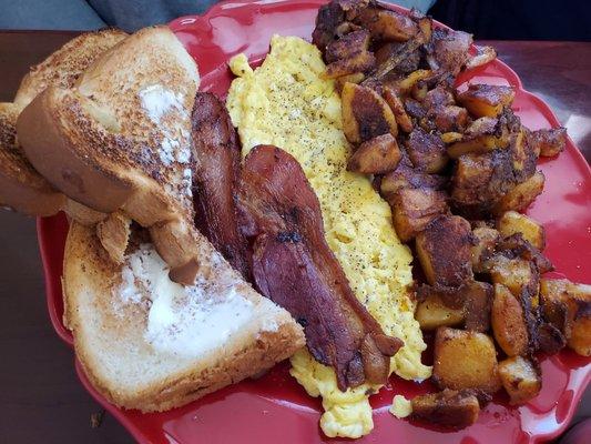 Scrambled eggs, white toast ,bacon and well done home fries