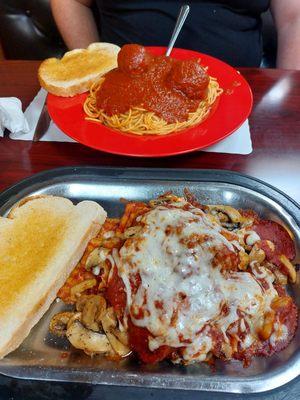 Lasagna topped with grilled mushrooms. Spaghetti with meatballs.