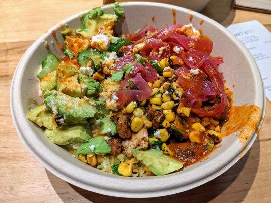 Harissa Avocado Bowl. $12.95. Harissa honey chicken, "crazy" feta, hummus, feta, avocado, fire-roasted corn, Persian cucumber, and more.