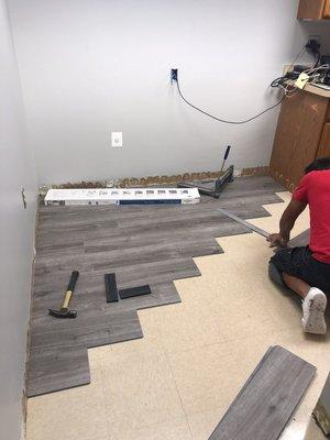 Installing new Luxury Vinyl Tile over existing Vinyl Composition Tile in kitchen at Law Firm in McLean Va.