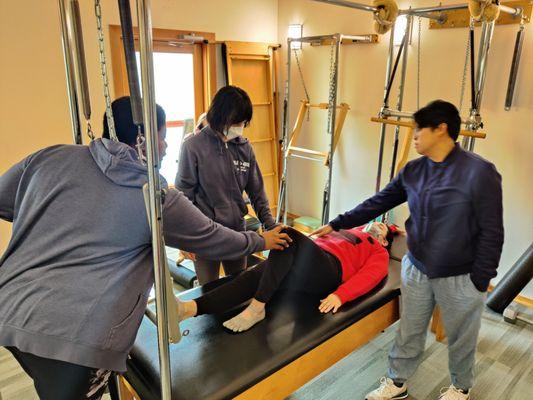 A teacher certification apprentice meeting where teacher in training learn how to cue Pilates breathing.