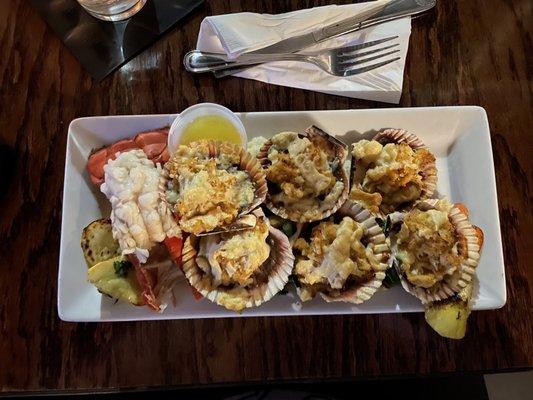 Stuffed scallops, mashed potatoes, and roasted veggies. Added on a lobster tail.