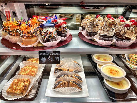 More adorable decorated individual cupcakes for just $1.99 each on the top and some other treats like cannoli & creme brûlée below.