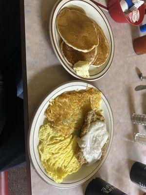 Chicken fried steak, scrambled eggs and pancakes