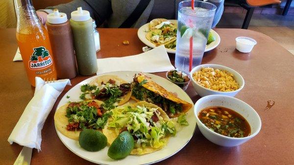 Left-right chorizo, pastor, quesibrria, fish Pico de gallo, rice, consume