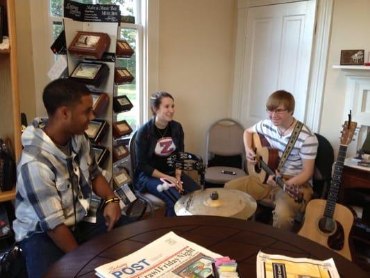 Group from Frist Baptist singing during Zacharys Art Crawl