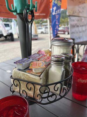 Basket hung on outside table.