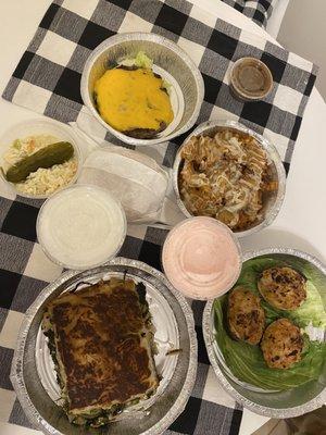 Spanakopita, Cheeseburger (bun on side), Clams, and Waffle French Fries with Melted Cheese. Vanilla and Strawberry Milkshake