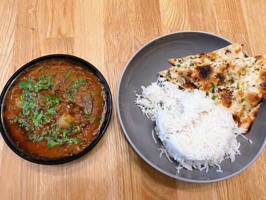 Goat masala Togo with garlic naan