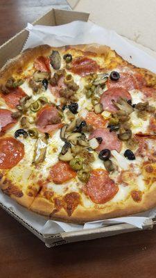 Mushrooms, olives ( black and green), onions, Canadian bacon, sausage, and pepperoni.