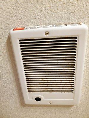 bathroom wall heater (and room heater) gross with rust and since not in use why not remove them/plaster the wall and repaint.