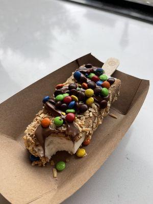 Vegan Coconet Paleta with cookie butter, coconut flakes, Nutella and M&Ms.  Honestly the best dessert I've ever had.