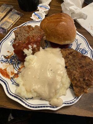 Meatloaf, mashed potatoes, chicken fried steak and hot roll