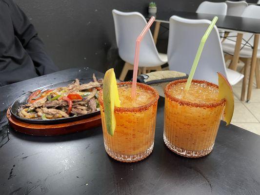 Mango mezcal cocktails and steak fajitas