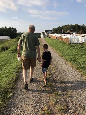 My son and husband walking around the farm.