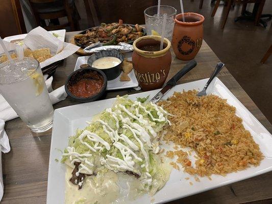 Steak burrito without pico de gallo, added lettuce, sour cream, and a side of rice.