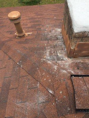 the residue left on my shingles after replacing the chimney cap