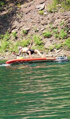 Oh Boy!  Our fearless SUP Yoga teacher making a splash!