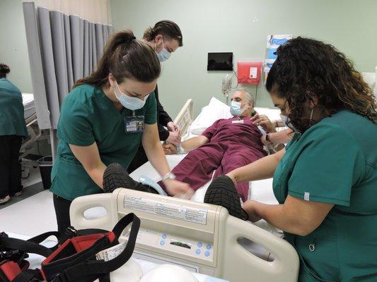 Our Salem PN students studying restraint training. Learning to safely restrain a patient who may be a danger to themselves. #iotlife #iotsal