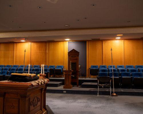 A wood paneled ceremony room with theatre -style seating.  This impressive ceremony room will accommodate up to 202 people.