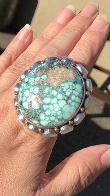 Turquoise with mother of pearl stones.