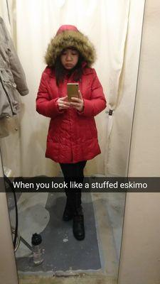 Photo of my red down puffy coat that got dry cleaned for $20