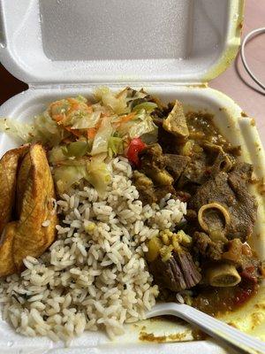 Curry goat with spinach rice