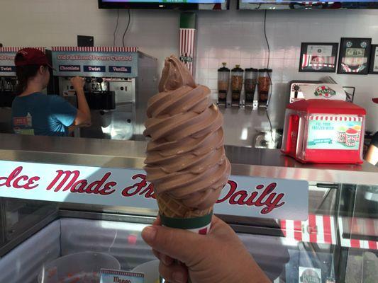 Large chocolate custard in a plain waffle cone