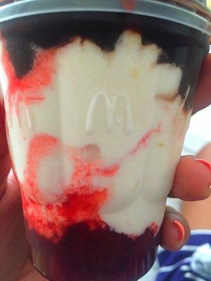 sundae with strawberries at the bottom and hot fudge on top