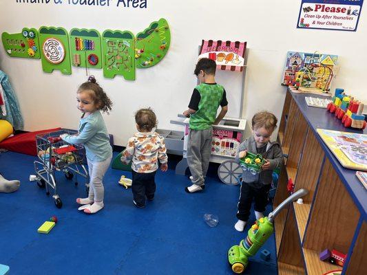 Toddler area. Shopping cart, doctors office, ice cream stand, Melissa and Doug grocery checkout. Dress up! And so much more!