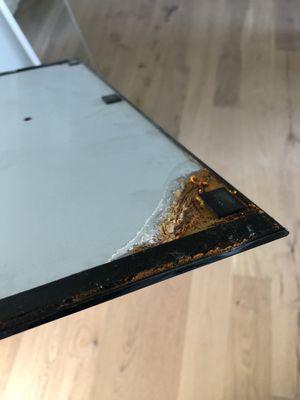 Orange liquid crusted TV base.