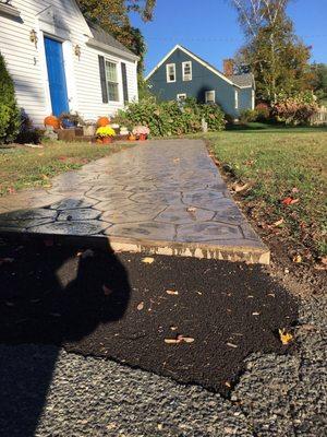 The view from the driveway of our brand new stamped concrete by spartan!