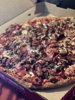 EXTRA LARGE PIZZA w/ pepperoni, sausage, mushrooms, ham, ground beef & bacon.