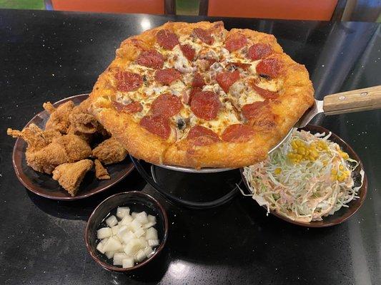 10" Regular Carnivore Pizza with a Royal (cheese) crust, Half Extra Crispy Chicken, Corn Salad, and Pickled Radish.