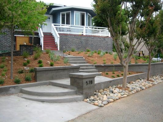 Front yard reconstructed with board-formed concrete and water-wise plantings