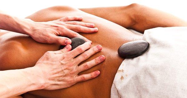 Hot Stone Massage - Combines deep heat from hand held stones with swedish massage strokes to help relax muscles & break up knots.