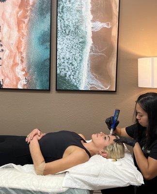 Our Naturopathic MD, Dr. Elaine, providing the PRP Facial Rejuvenation treatment. This facial induces collagen and elastin formation.