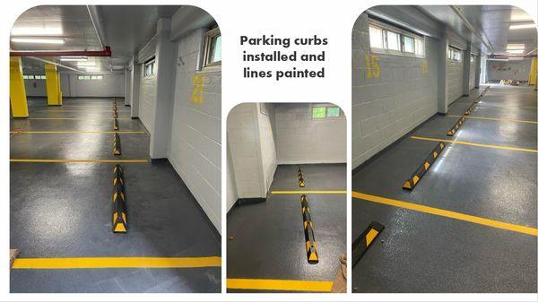 Parking curbs installed and lines painted