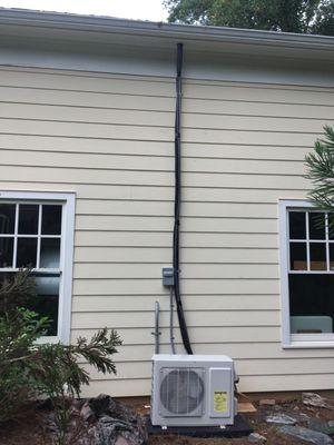 Cool King  HVAC Installation UNSIGHTLY tubes and wires outside garage.