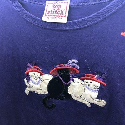 Red Hat Society, Feline Chapter. (There's a cat hair on this shirt.)