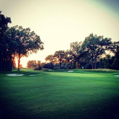 The green on the new 5th hole, with hole 3 in the background, at sunset.