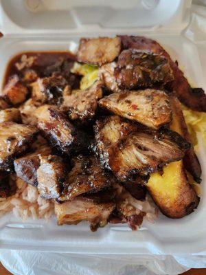 Jerk pork with jasmine rice & steamed cabbage and sweet plantain.