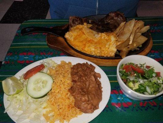 Beef fajitas with all the fixins ane sides