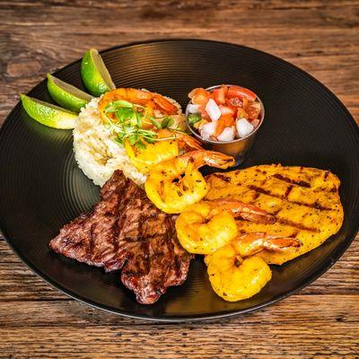 Surf and Turf - skirt steak, chicken, and shrimp with rice and picó de gallo