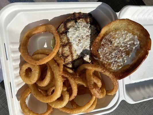 Turkey burger with onion rings.