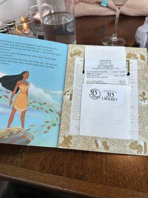 Neat idea.  Check served up in an old school book.