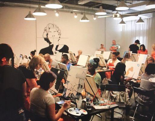 Opening night at The Beltline Studio where artists selected one of several themes to paint.