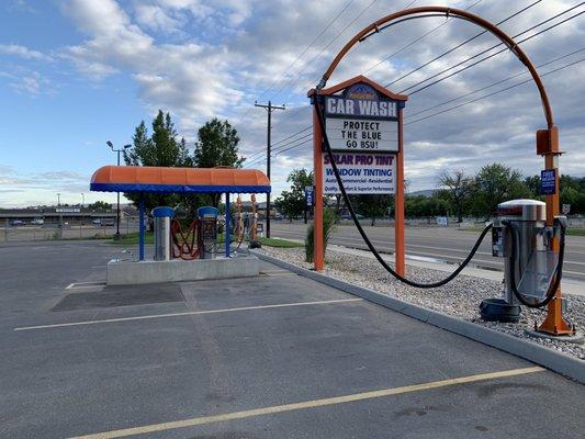 Street signage on bottom. Looking from car wash area adjacent to store.