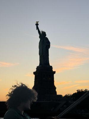 Sunset sail view of Staie of Liberty